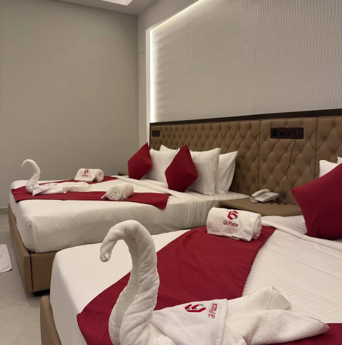 Beds made up with towel swans in a GR Plaza luxury room