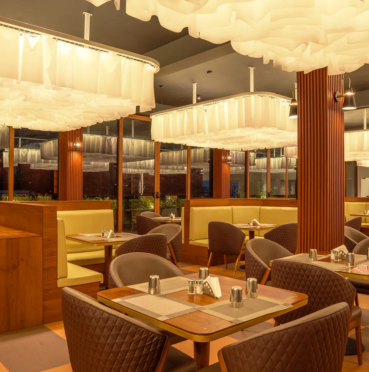 Dining room at Salem RR Biriyani under cloud-like ceiling lights