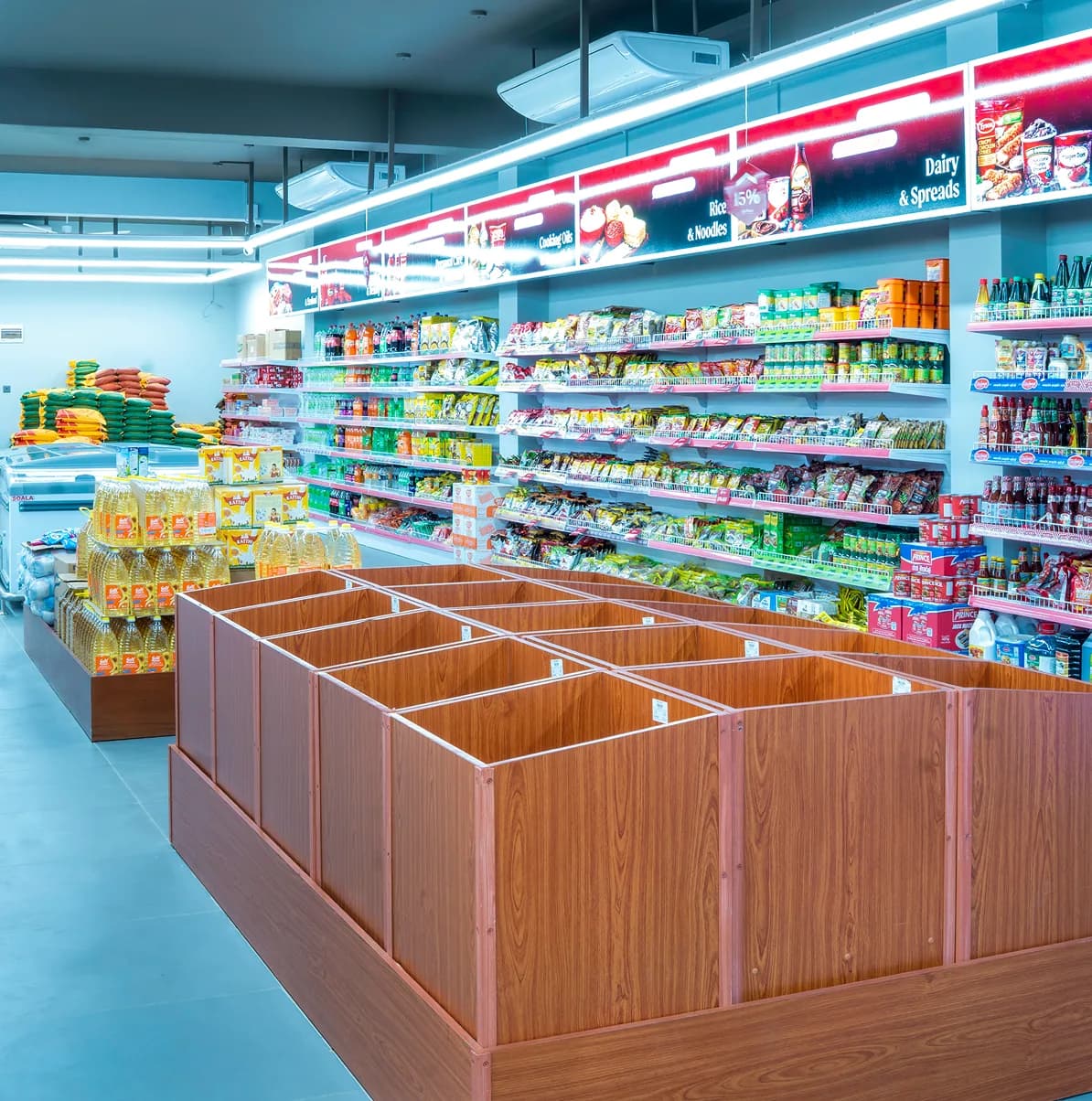 Fresh produce bins and stocked aisles inside GR Super Market